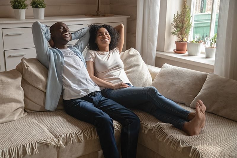 Image of couple enjoying indoors. Air Filters vs. Air Cleaners.
