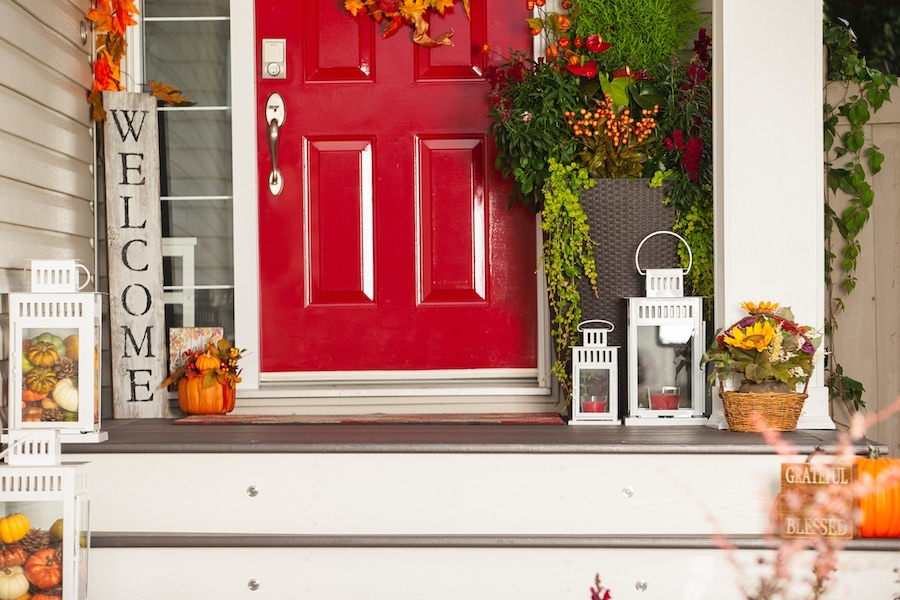 Outdoor decorations on porch looking festive after homeowner scheduled their fall HVAC maintenance